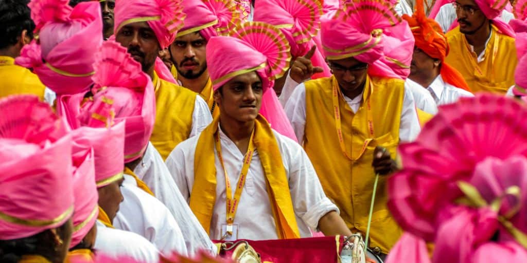 a group of people wearing colorful hats